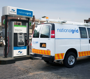 Photo of utility van with "national grid" logo on side, refueling at CNG station.